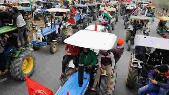 FILE PHOTO: Farmers participate in a tractor rally to protest against the newly passed farm bills, on a highway on the outskirts of New Delhi, India, January 7, 2021. REUTERS/Adnan Abidi/File Photo(REUTERS)