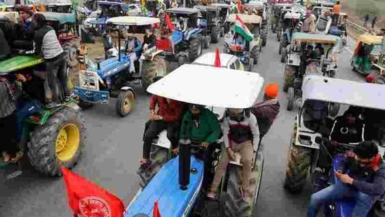 Farmers participate in a tractor rally to protest against the newly passed farm bills, on a highway on the outskirts of New Delhi. (REUTERS)