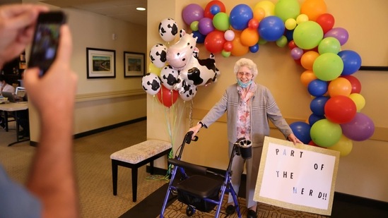 Marcie Meek, 88, poses for a photo with a sign referring to herd immunity after receiving the Covid-19 vaccine at the Brightwater Senior Living community in Highland, California on January 22. Vaccination has become ever more urgent with the recent emergence of several coronavirus variants believed to be more transmissible, and in the case of one strain first detected in Britain, possibly more lethal.(Luck Nicholson / REUTERS)