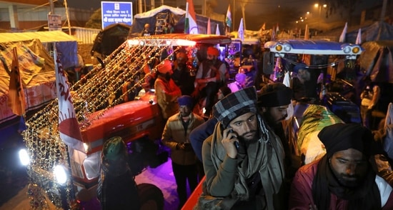 Farmers prepare for a tractor rally against the newly passed farm laws ahead of Republic Day at Singhu border near New Delhi. (REUTERS) Farmers prepare for a tractor rally against the newly passed farm laws ahead of Republic Day at Singhu border near New Delhi. (REUTERS)