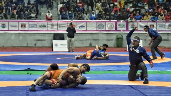 Wrestlers participate in the 65th Senior Men Free Wrestling Championship at Noida Stadium.(ANI Photo) Wrestlers participate in the 65th Senior Men Free Wrestling Championship at Noida Stadium.(ANI Photo)