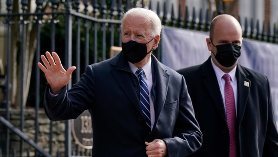 President Joe Biden waves as he departs after attending Mass at Holy Trinity Catholic Church.(AP) President Joe Biden waves as he departs after attending Mass at Holy Trinity Catholic Church.(AP)