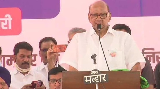 NCP chief addressing the farmers at Mumbai's Azad Maidan on Monday.(ANI Photo)