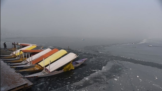 Shikara boats docked on a layer of ice after a large part of the Dal Lake froze over in Srinagar. (HT file photo) Shikara boats docked on a layer of ice after a large part of the Dal Lake froze over in Srinagar. (HT file photo)