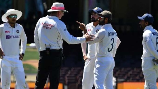 Ajinkya Rahane in a conversation with the umpire as the game was halted after allegedly some remarks were made by the spectators on the fourth day of the Sydney Test(Twitter) Ajinkya Rahane in a conversation with the umpire as the game was halted after allegedly some remarks were made by the spectators on the fourth day of the Sydney Test(Twitter)