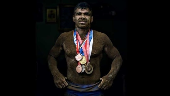 Deaf Olympic Gold medalist wrestler Virender Singh poses for a portrait with his medals at his akhara near Sadar Bazar in New Delhi.(Ravi Choudhary/HT PHOTO) Deaf Olympic Gold medalist wrestler Virender Singh poses for a portrait with his medals at his akhara near Sadar Bazar in New Delhi.(Ravi Choudhary/HT PHOTO)
