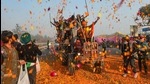 Farmers shower flower petals on fellow farmers riding on their tractors after breaking the police barricades at Singhu border during the 'Kisan Gantantra Parade' on Republic Day in New Delhi. (PT) Farmers shower flower petals on fellow farmers riding on their tractors after breaking the police barricades at Singhu border during the 'Kisan Gantantra Parade' on Republic Day in New Delhi. (PT)