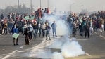 Smoke billows from a tear gas shell during a tractor rally by farmers to protest against farm laws on Republic Day at Ghazipur border near Delhi(Reuters) Smoke billows from a tear gas shell during a tractor rally by farmers to protest against farm laws on Republic Day at Ghazipur border near Delhi(Reuters)