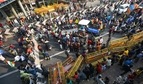 Farmers breaking the barricades as they head towards Delhi during a tractor rally to protest against farm laws at Singhu border in New Delhi. (Amal KS/ Hindustan Times) Farmers breaking the barricades as they head towards Delhi during a tractor rally to protest against farm laws at Singhu border in New Delhi. (Amal KS/ Hindustan Times)
