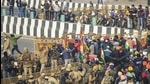 Farmers break the police barricades at the Ghazipur border as move towards Akshardham during their tractor rally on Republic Day in New Delhi, Tuesday, January 26. (PTi) Farmers break the police barricades at the Ghazipur border as move towards Akshardham during their tractor rally on Republic Day in New Delhi, Tuesday, January 26. (PTi)