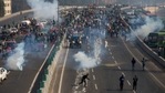 A protesting farmer hurls back a tear gas shell towards police as they march to the capital breaking police barricades during Republic Day celebrations in New Delhi, on Tuesday.(AP Photo) A protesting farmer hurls back a tear gas shell towards police as they march to the capital breaking police barricades during Republic Day celebrations in New Delhi, on Tuesday.(AP Photo)