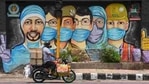 A motorist passes by a mural of frontline workers against coronavirus at RK Puram in New Delhi on July 25. Delhi’s Covid-19 recoveries have outstripped new cases on almost all days this month barring a few exceptions, after ramped-up containment and testing efforts over the past month or so. (Sanchit Khanna / HT Photo) A motorist passes by a mural of frontline workers against coronavirus at RK Puram in New Delhi on July 25. Delhi’s Covid-19 recoveries have outstripped new cases on almost all days this month barring a few exceptions, after ramped-up containment and testing efforts over the past month or so. (Sanchit Khanna / HT Photo)