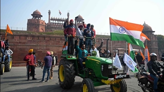 Farmers take part in a tractor rally as they continue to protest against the central government's recent agricultural reforms, in front of Red Fort in New Delhi on January 26, 2021. (AFP)