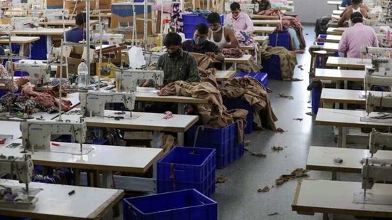 Workers stitch garments at a factory of an apparel shop in Jaipur.(REUTERS) Workers stitch garments at a factory of an apparel shop in Jaipur.(REUTERS)