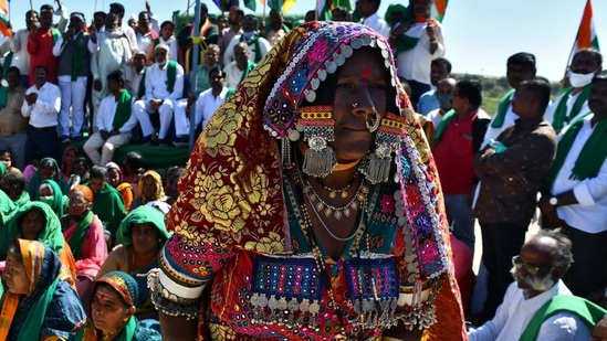 People gather before taking part in a tractor rally to protest against farm laws in Bengaluru(Reuters) People gather before taking part in a tractor rally to protest against farm laws in Bengaluru(Reuters)