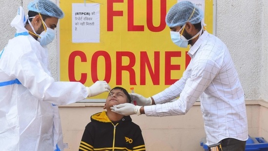 A health worker collects a swab sample from a child for coronavirus testing at Rajiv Gandhi Super Speciality Hospital in New Delhi.(Raj K Raj/ Hindustan Times) A health worker collects a swab sample from a child for coronavirus testing at Rajiv Gandhi Super Speciality Hospital in New Delhi.(Raj K Raj/ Hindustan Times)