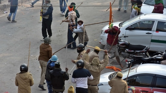 Farmers and Delhi Police personnel clash during the tractor march from Tikri border, at Nangloi Crossing, in New Delhi(Raj K Raj/ Hindustan Times) Farmers and Delhi Police personnel clash during the tractor march from Tikri border, at Nangloi Crossing, in New Delhi(Raj K Raj/ Hindustan Times)