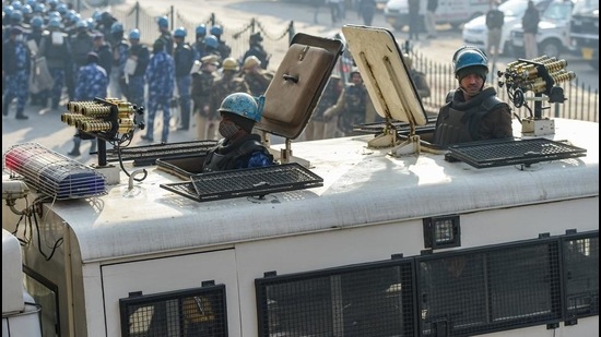 Security personnel stand guard at Nangloi during farmer's tractor rally in New Delhi, on Tuesday, January 26. (PTI) Security personnel stand guard at Nangloi during farmer's tractor rally in New Delhi, on Tuesday, January 26. (PTI)