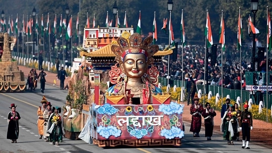 Performers dance next to a float representing Ladakh during Republic Day celebrations in New Delhi on January 26. The Ladakh tableau made its debut this year highlighting the vision for it to be carbon neutral.(Jewel Samad / AFP)