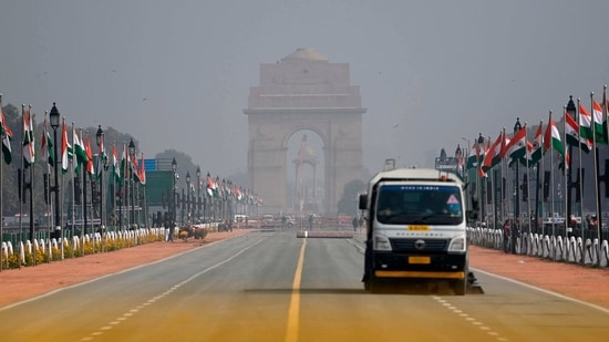 A vehicle cleans Rajpath on the eve of Republic Day celebrations in New Delhi.(AFP) A vehicle cleans Rajpath on the eve of Republic Day celebrations in New Delhi.(AFP)
