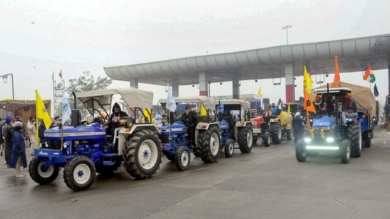 Haryana farmers welcome farmers of Punjab moving towards Delhi to take part in their Jan 26 tractor rally, as part of the ongoing agitation against farm reform laws, at Shambu Punjab-Haryana border near Patiala. (PTI Photo)