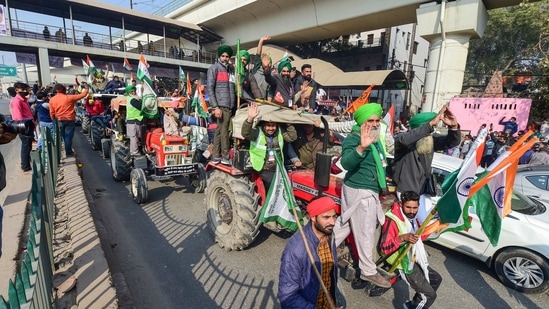 Farmers participate in tractor rally, during their ongoing protest against Centre's farm reform laws, near Nangloi in New Delhi on Tuesday.(PTI Photo)