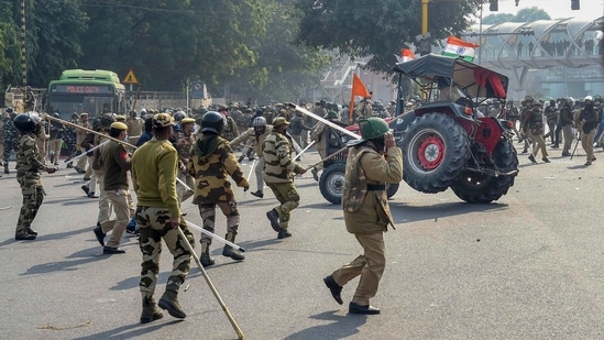 Police lathicharge farmers who were attempting to break barricades at ITO during their 'tractor march' on Republic Day, in New Delhi on Tuesday.(PTI Photo)