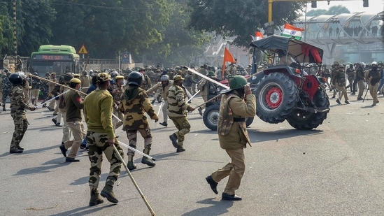 Police lathicharge farmers who were attempting to break barricades at ITO during their 'tractor march' on Republic Day, in New Delhi on Tuesday.(PTI Photo) Police lathicharge farmers who were attempting to break barricades at ITO during their 'tractor march' on Republic Day, in New Delhi on Tuesday.(PTI Photo)