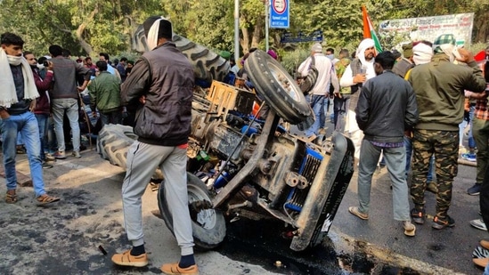 The overturned tractor in Delhi under which the body of a farmer was found on Tuesday.(HT Photo)