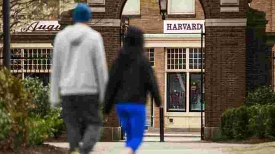 Pedestrians walk through Harvard Yard on the closed Harvard University campus in Cambridge, Massachusetts, US.(Bloomberg) Pedestrians walk through Harvard Yard on the closed Harvard University campus in Cambridge, Massachusetts, US.(Bloomberg)