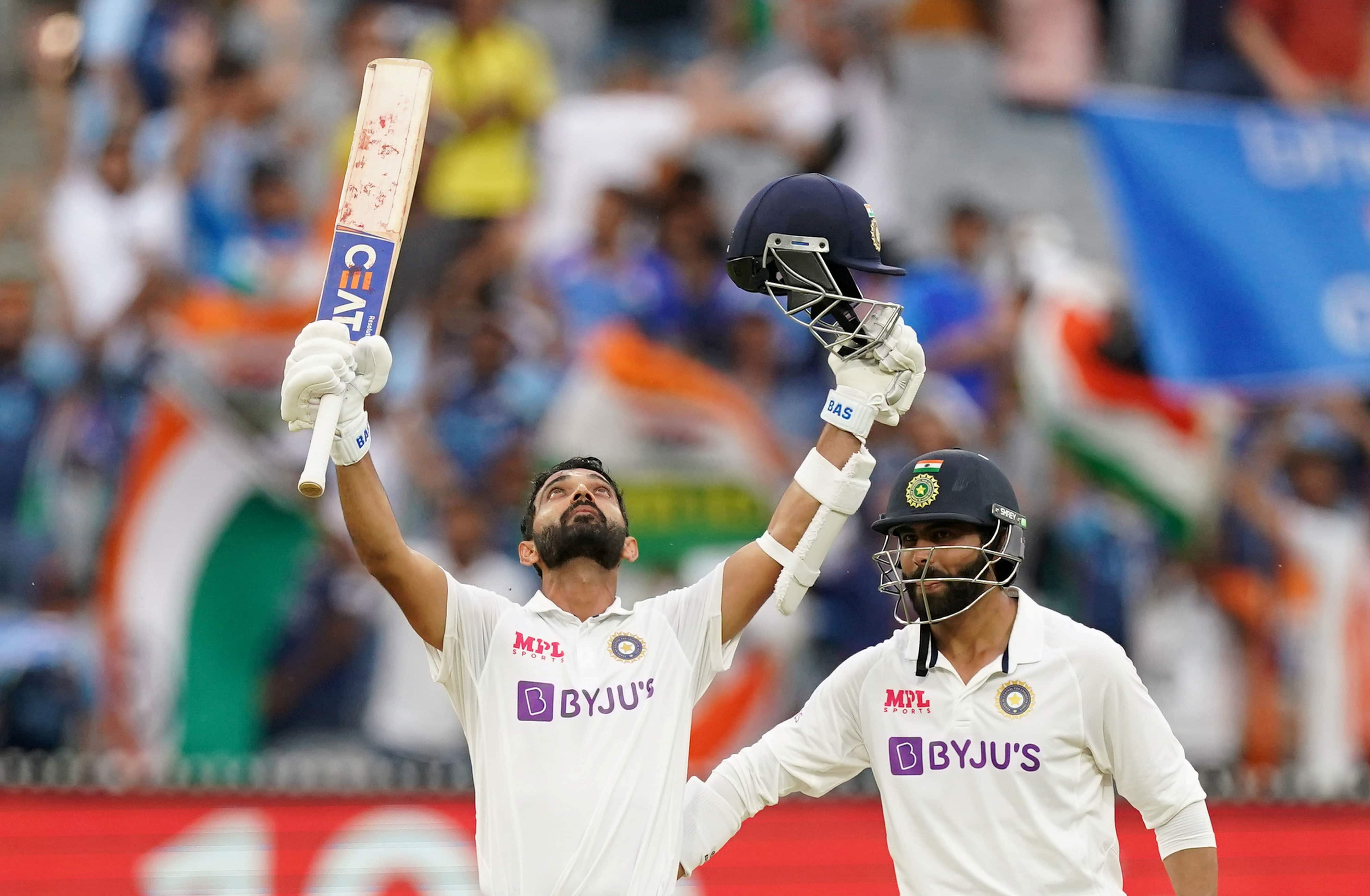 India's Ajinkya Rahane celebrates after reaching his century as his teammate Ravindra Jadeja looks on during day two of the second test match between Australia and India at The MCG, Melbourne, Australia. (via REUTERS)