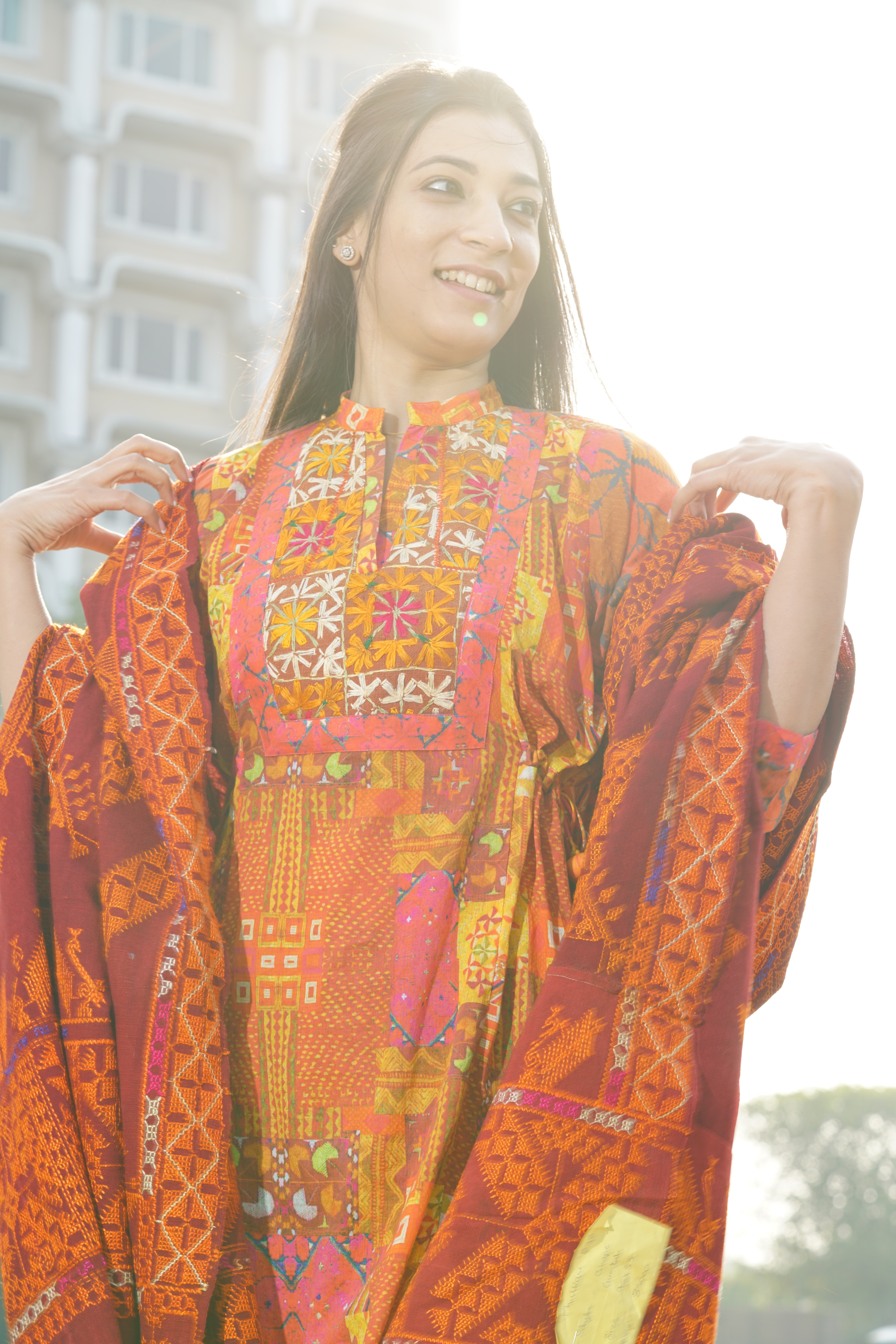 Parisa’s dupatta in kesari and basanti colours is teamed with a kurta in ikka baagh pattern. The buti gotta patti work adds a festive vibe. (Photo: Ichit Anand) Parisa’s dupatta in kesari and basanti colours is teamed with a kurta in ikka baagh pattern. The buti gotta patti work adds a festive vibe. (Photo: Ichit Anand)