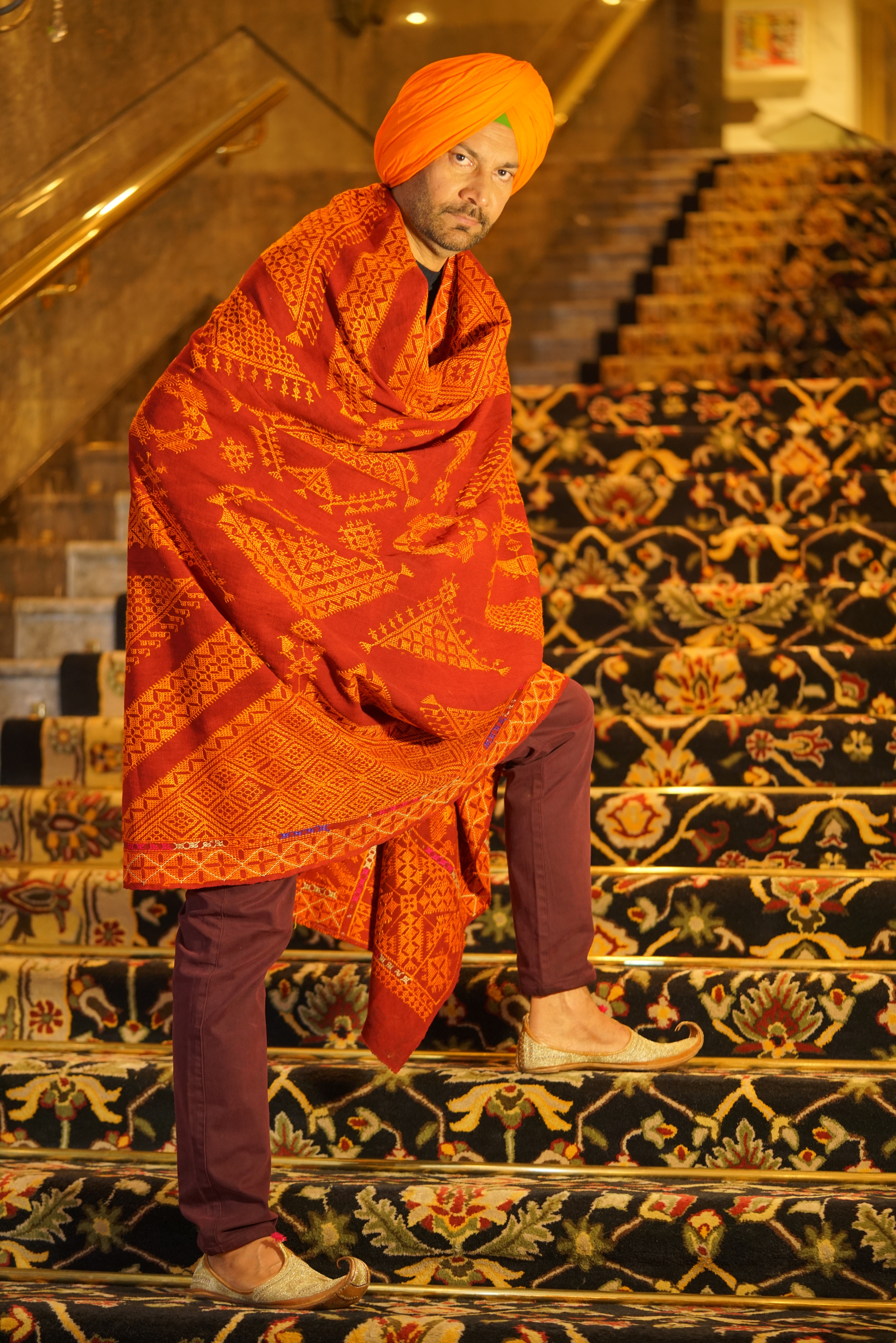 Jasbir Jassi brings alive the charm of an indigenous weave with the khaddar he is adorning. The shawl with gold thread embroidery carries on its back the lore of folktales and exquisite craftsmanship of Punjab. His kesari turban celebrates the warrior tradition of Sikhs. (Photo: Ichit Anand) Jasbir Jassi brings alive the charm of an indigenous weave with the khaddar he is adorning. The shawl with gold thread embroidery carries on its back the lore of folktales and exquisite craftsmanship of Punjab. His kesari turban celebrates the warrior tradition of Sikhs. (Photo: Ichit Anand)