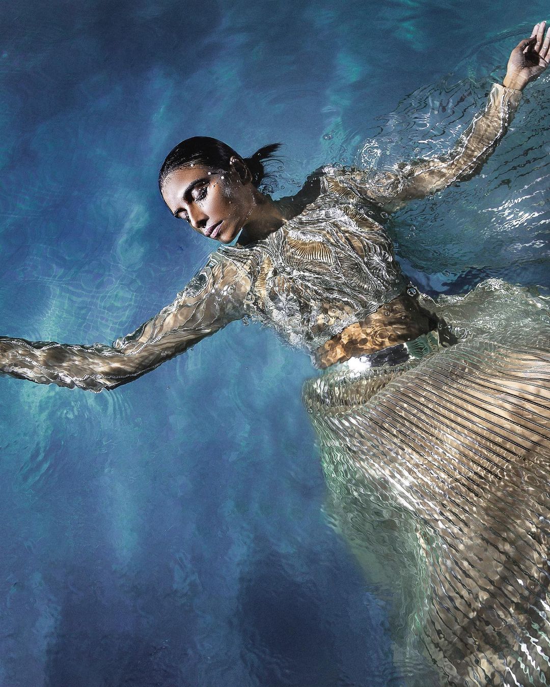 Model Laxmi Pandey wears a structured lehenga in metallic polymer paired with hand embroidered blouse in pearls and a winged palla from Amit Aggarwal’s couture. (Photo: Instagram/AmitAggarwalOfficial) Model Laxmi Pandey wears a structured lehenga in metallic polymer paired with hand embroidered blouse in pearls and a winged palla from Amit Aggarwal’s couture. (Photo: Instagram/AmitAggarwalOfficial)