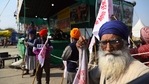 Indian farmer volunteers managing the stage keep guard at Singhu, the Delhi-Haryana border camp for protesting farmers against three farm bills, in New Delhi, India, Wednesday, Jan. 27, 2021.(AP) Indian farmer volunteers managing the stage keep guard at Singhu, the Delhi-Haryana border camp for protesting farmers against three farm bills, in New Delhi, India, Wednesday, Jan. 27, 2021.(AP)