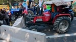 Farmers on tractors remove concrete barricades installed to prevent them from entering the city during the tractor rally in New Delhi on January 26.(Sajjad Hussain / AFP) Farmers on tractors remove concrete barricades installed to prevent them from entering the city during the tractor rally in New Delhi on January 26.(Sajjad Hussain / AFP)