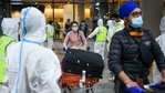 Municipal workers in PPE look on as passengers from United Kingdom arrive at Mumbai airport.(PTI File Photo) Municipal workers in PPE look on as passengers from United Kingdom arrive at Mumbai airport.(PTI File Photo)