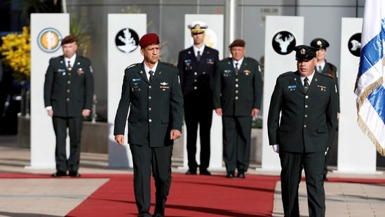 Israeli Chief of Staff Aviv Kohavi reviews an honour guard during a handover ceremony in Tel Aviv, Israel.(Reuters)