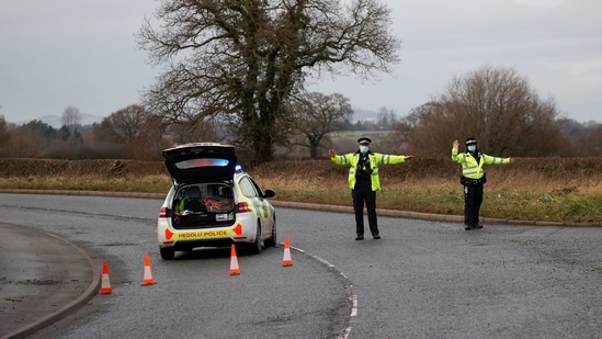 Police officers manage a checkpoint on a road near the Wockhardt pharmaceutical plant in Wrexham, Britain January 27, 2021. REUTERS/Phil Noble (REUTERS)