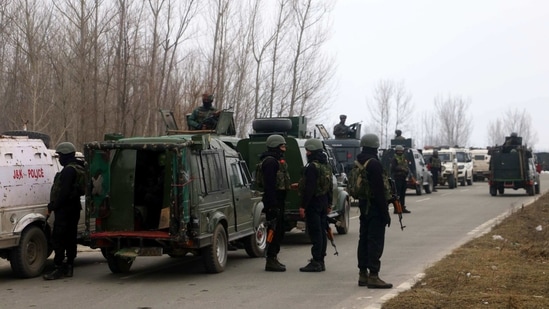 Security personnel stand guard after Improvised Explosive Device (IED) blast near a school in Shamsipora area of South Kashmir's Kulgam district on Wednesday. (ANI Photo) Security personnel stand guard after Improvised Explosive Device (IED) blast near a school in Shamsipora area of South Kashmir's Kulgam district on Wednesday. (ANI Photo)