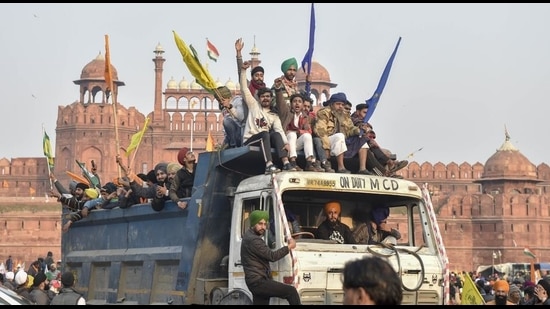 Farmers arrive at Red Fort during their tractor parade on Republic Day, in New Delhi. (PTI)