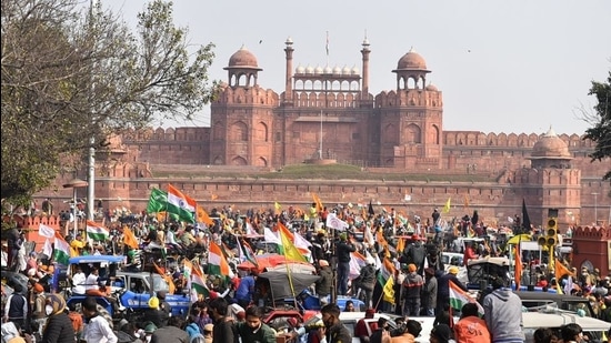 Farmers gather at Red Fort during their tractor parade on Republic Day, in New Delhi. (PTI)