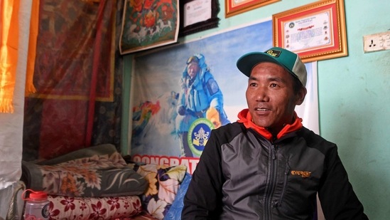 Nepalese mountaineer Kami Rita Sherpa, who has climbed Everest a record 24 times, speaks during an interview with AFP on January 19. Kami Rita Sherpa said the recognition was long overdue. "The Western climbers did not set the records without the help of Sherpas," he told AFP. "All the routes are set by us, the food is cooked by us, their loads are carried by our brothers -- they haven't done it alone."(Prakash Mathema / AFP)