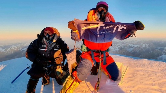Nepalese mountaineer Sona Sherpa (R) and Mingma David Sherpa pose for pictures after reaching the summit of Mt K2. "When I heard the K2 news I thought 'finally!'" Italy's legendary mountaineer Reinhold Messner told AFP.(Seven Summit Treks / AFP)