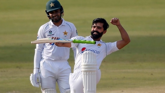 Pakistan's Fawad Alam celebrates after scoring a century during the second day of the first cricket test match between Pakistan and South Africa at the National Stadium, in Karachi(AP)