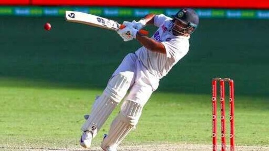 India's Rishabh Pant falls as he hits the ball for four runs during play on the final day of the fourth cricket test between India and Australia at the Gabba, Brisbane.(AP) India's Rishabh Pant falls as he hits the ball for four runs during play on the final day of the fourth cricket test between India and Australia at the Gabba, Brisbane.(AP)