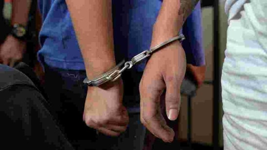 The hands of two men, who customs authorities say imported 8 million pesos ($162,500) worth of illegal drugs, are seen in handcuffs as they are presented to reporters at the Bureau of Customs in Pasay city, Metro Manila, Philippines November 14, 2016. REUTERS/Ezra Acayan(REUTERS)