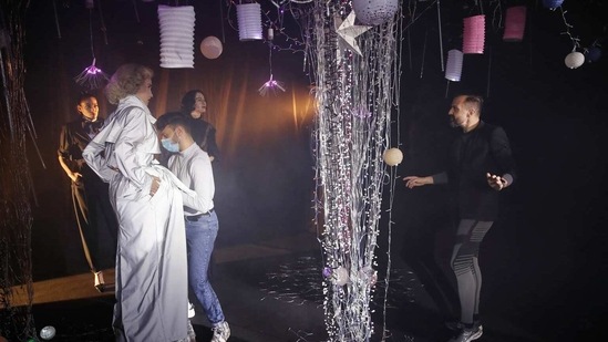 French designer Julien Fournie, right, gives instructions to the models during the shoot for his Haute Couture Spring/Summer 2021 fashion collection for a digital presentation of the fashion week, in Paris, Thursday, Jan. 7, 2021. (AP)