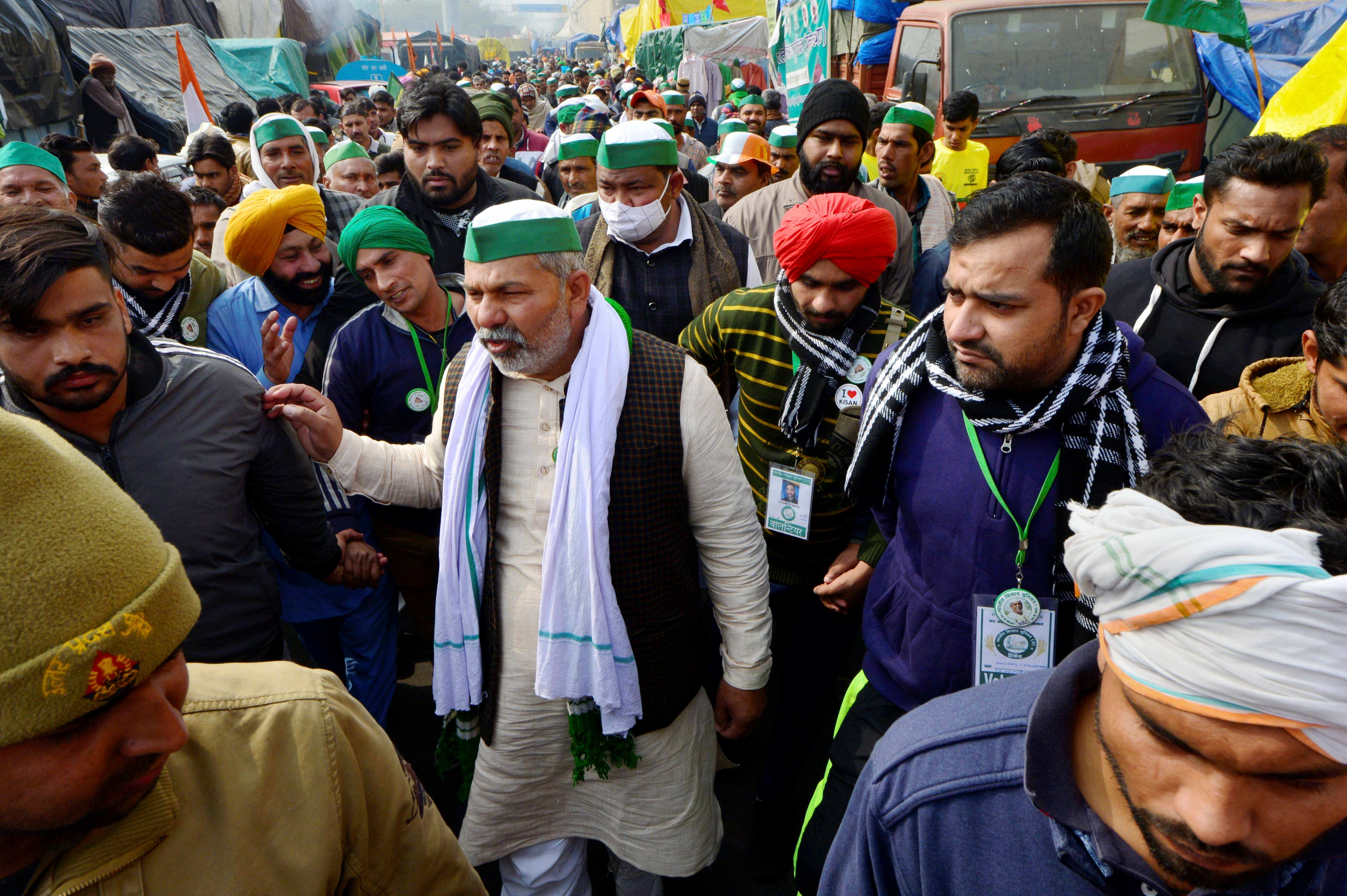 New Delhi: BKU spokesperson Rakesh Tikait along with farmers during their ongoing protest against the new farm laws, at Ghazipur border in New Delhi, Monday, Jan. 25, 2021. (PTI Photo/Ravi Choudhary)(PTI01_25_2021_000121A) (PTI) New Delhi: BKU spokesperson Rakesh Tikait along with farmers during their ongoing protest against the new farm laws, at Ghazipur border in New Delhi, Monday, Jan. 25, 2021. (PTI Photo/Ravi Choudhary)(PTI01_25_2021_000121A) (PTI)