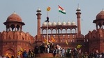 FILE - In this Tuesday, Jan. 26, 2021, file photo, a Sikh man hangs on to pole holding a Sikh religious flag along with a farm union flag at the historic Red Fort monument during a farmers protest against new farm laws in New Delhi, India. A sea of tens of thousands of farmers riding tractors and horses stormed India’s historic Red Fort this week — a dramatic escalation of their protests, which are posing a major challenge to Prime Minister Narendra Modi’s government. (AP Photo/Dinesh Joshi, File)(AP) FILE - In this Tuesday, Jan. 26, 2021, file photo, a Sikh man hangs on to pole holding a Sikh religious flag along with a farm union flag at the historic Red Fort monument during a farmers protest against new farm laws in New Delhi, India. A sea of tens of thousands of farmers riding tractors and horses stormed India’s historic Red Fort this week — a dramatic escalation of their protests, which are posing a major challenge to Prime Minister Narendra Modi’s government. (AP Photo/Dinesh Joshi, File)(AP)